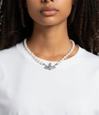 Plugmarket Vivienne Westwood pearl choker with Saturn Orb pendant adorned with white crystals. 40cm length.