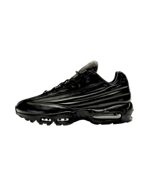Plugmarket Nike x Supreme Air Max 95 Lux Black leather sneakers with visible air cushioning.