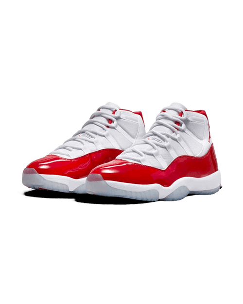 Plugmarket Air Jordan 11 Retro Cherry sneakers with white mesh uppers and patent leather red overlays.
