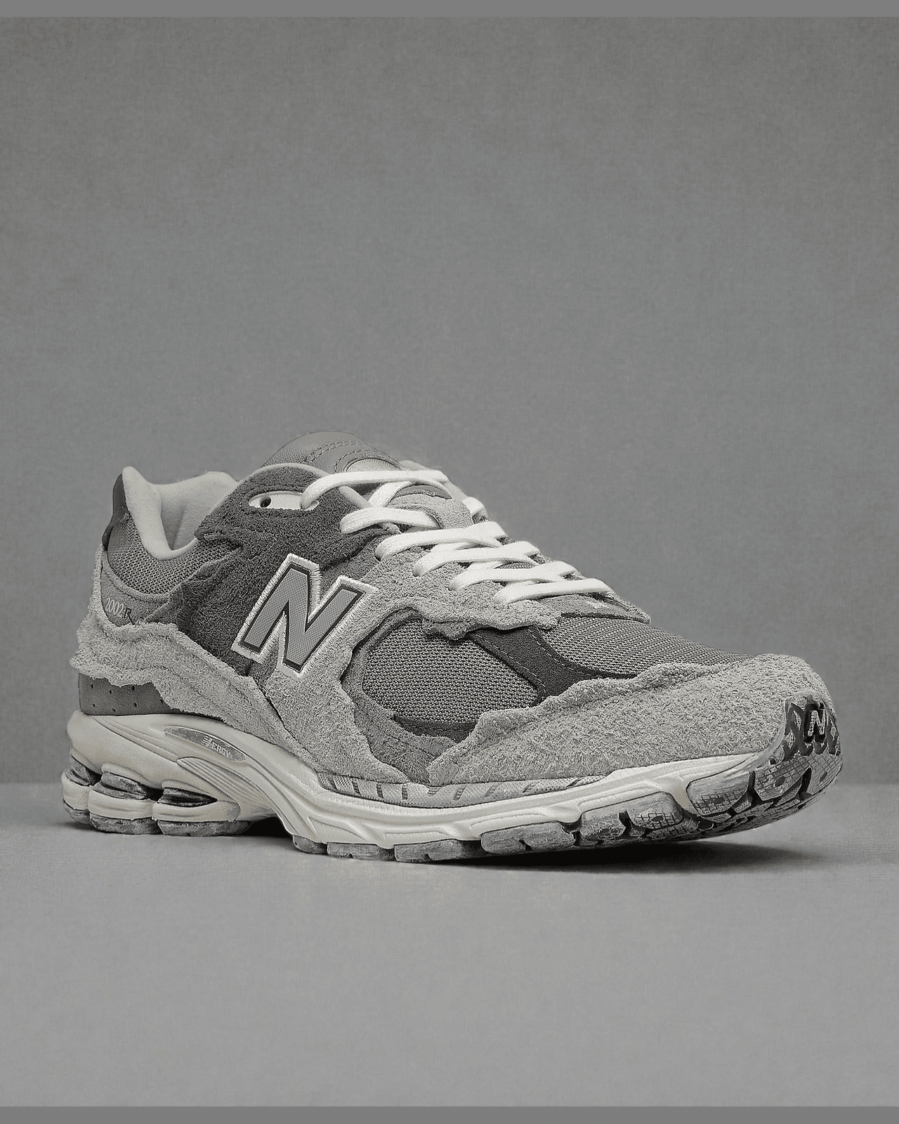 Plugmarket - New Balance 2002R Protection Pack Rain Cloud sneakers in grey suede and mesh with distressed detailing.