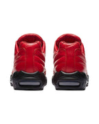 Plugmarket - Nike x Supreme Air Max 95 Lux Gym Red leather sneakers with black soles and visible air cushioning.