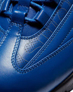 Plugmarket Nike x Supreme Air Max 95 Lux Hyper Cobalt blue leather sneakers with perforated details and gold accents.